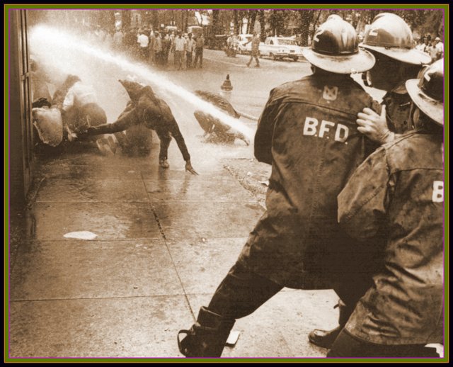 Bull Connor orders the Birmingham Fire Dept to turn high pressure hoses on African American protestors